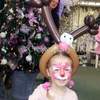 A watermarked balloom model reindeer hat and face painting